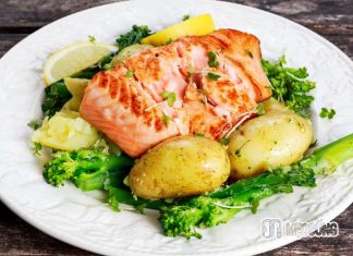 Salmon served with broccoli and potatoes